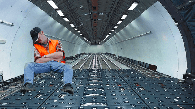 He falls asleep in the cargo hold and wakes up... in Abu Dhabi!